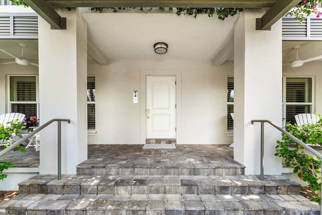 Experience refined coastal living in this impeccably remodeled turnkey residence just one block from the beach.