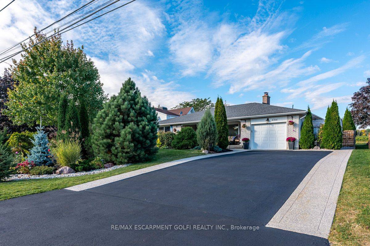 4364 Lincoln Ave, A 1300 sqft, fully finished brick bungalow on a vast 70x125 ft lot, overlooking the exquisite vineyards of the Beamsville bench.