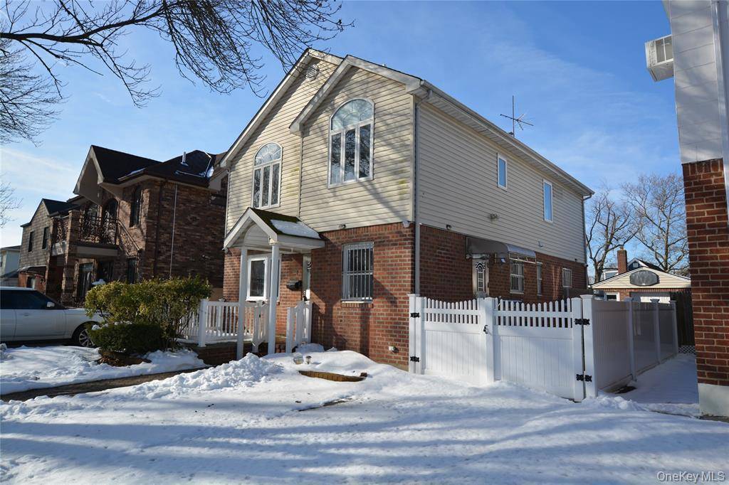 Beautifully renovated brick Colonial located in Bellerose on a quiet, tree lined street.