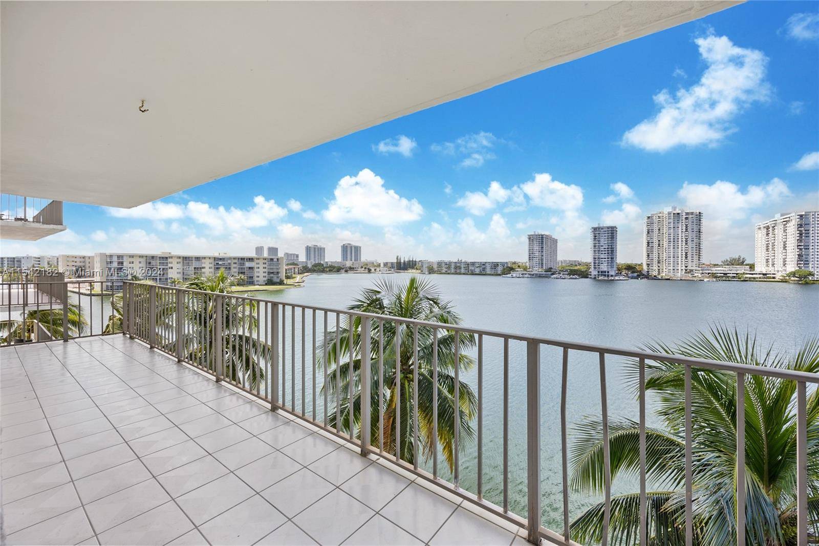 Completely renovated direct waterfront corner unit with spectacular views and wraparound balcony in the heart of Aventura next to exclusive Williams Island.