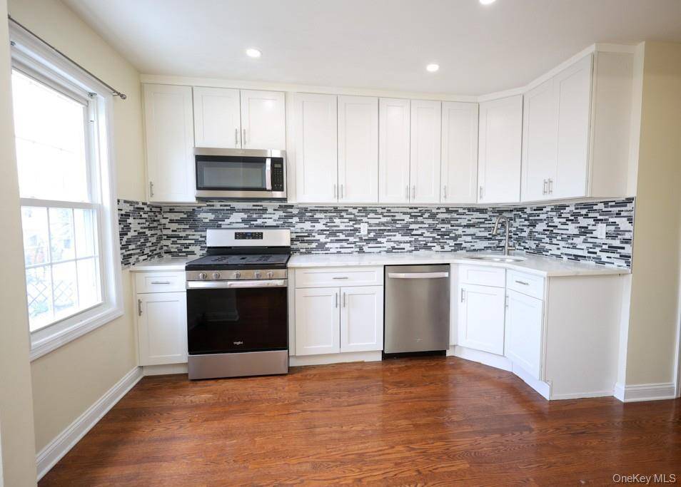 Beautiful two family home with huge backyard in vibrant neighborhood of Ozone Park, Queens.