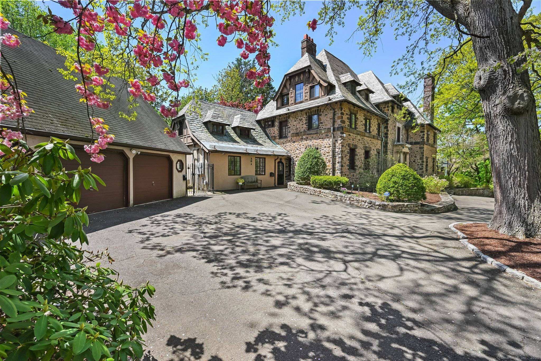 Nestled in New Haven's prestigious East Rock Prospect Hill neighborhood, this stunning 8, 430 sq ft Tudor mansion blends historic charm with modern luxury.