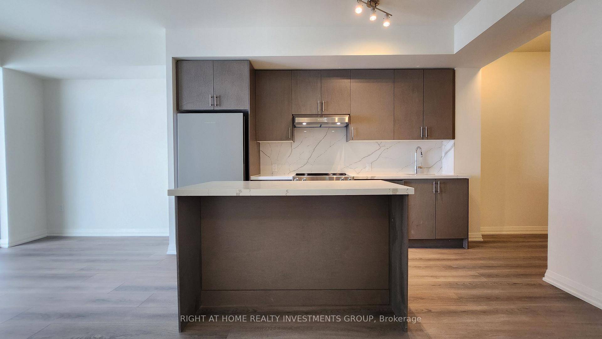 The luxury development boasts a plethora of amenities, including an outdoor pool, wellness centre, games room, theatre room, and a rooftop sky lounge offering panoramic views.