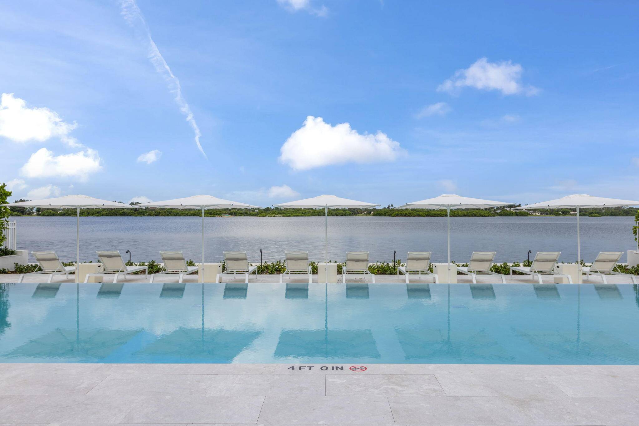 Completely and very tastefully renovated 2 bedroom apartment in a premier Palm Beach intracoastal building brand new custom kitchen Hermes wallpaper with a fully integrated and paneled Liebherr refrigerator and ...