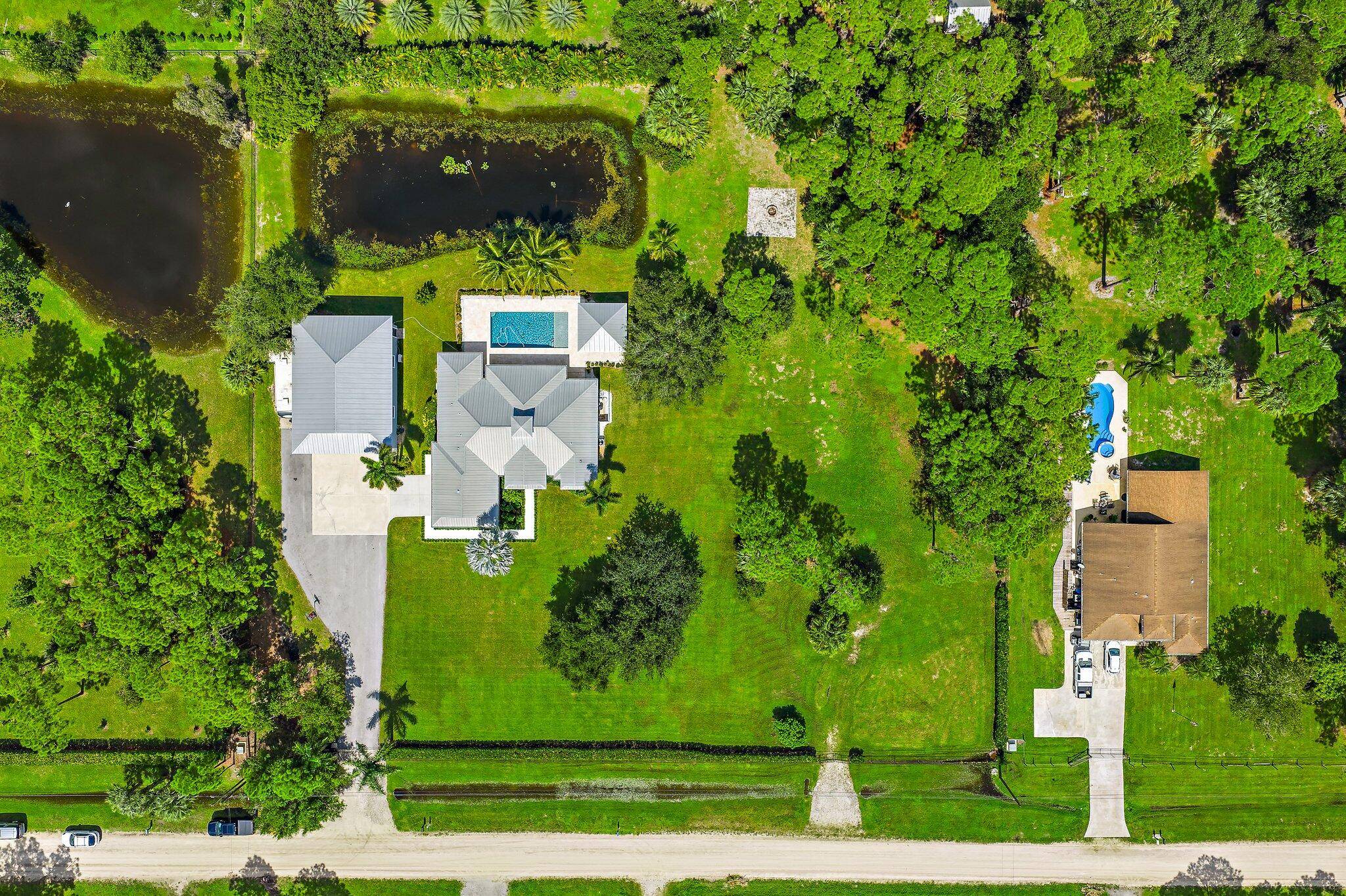 2. 4 Acres of pure elegance and exclusivity await with this completely remodeled estate home.