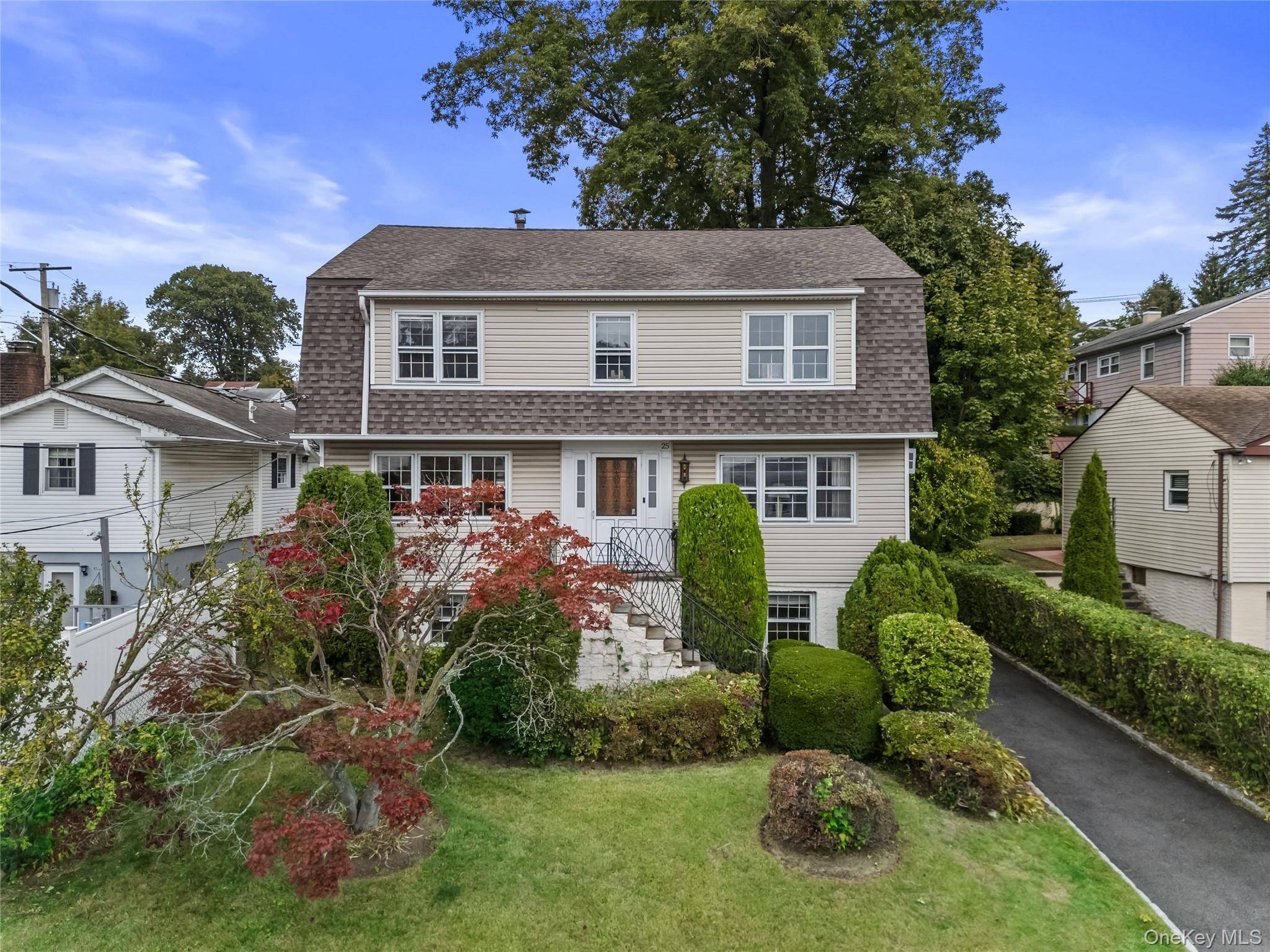 Bright and Inviting Center Hall Colonial with Legal Apartment !