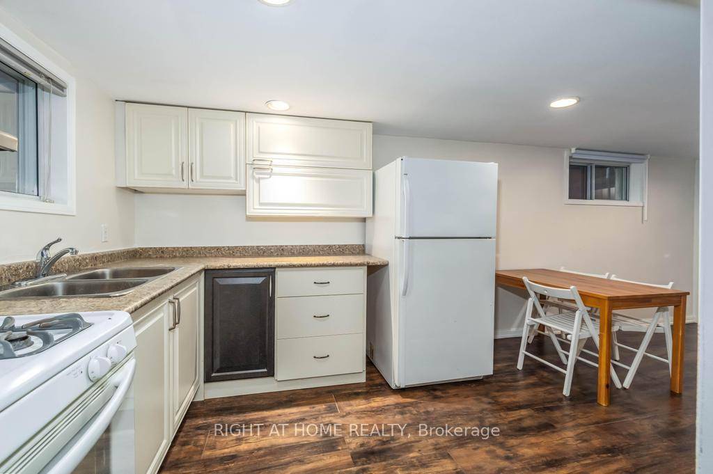 Welcome to this beautifully maintained 2 bedroom basement apartment with a separate entrance, high ceilings, and private walk out from the primary bedroom that fills the space with natural light.