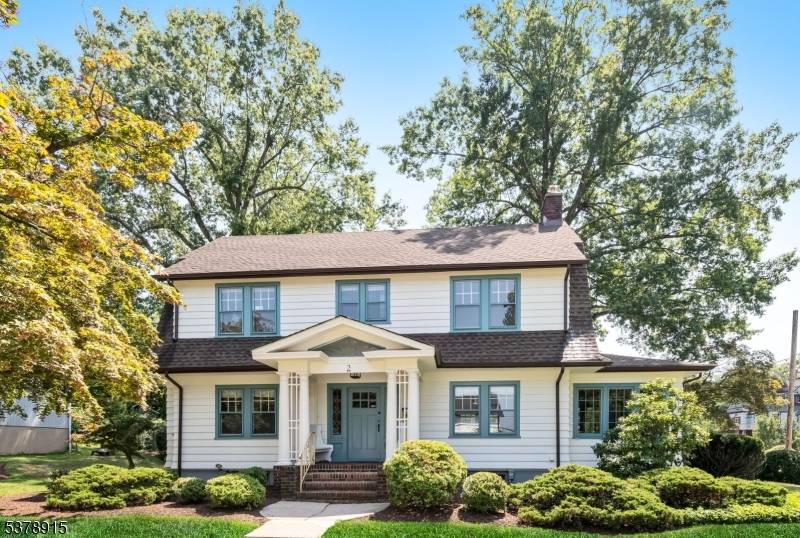 Enjoy sunset views from the charming front porch of this beautiful 4 bedroom Dutch Colonial.
