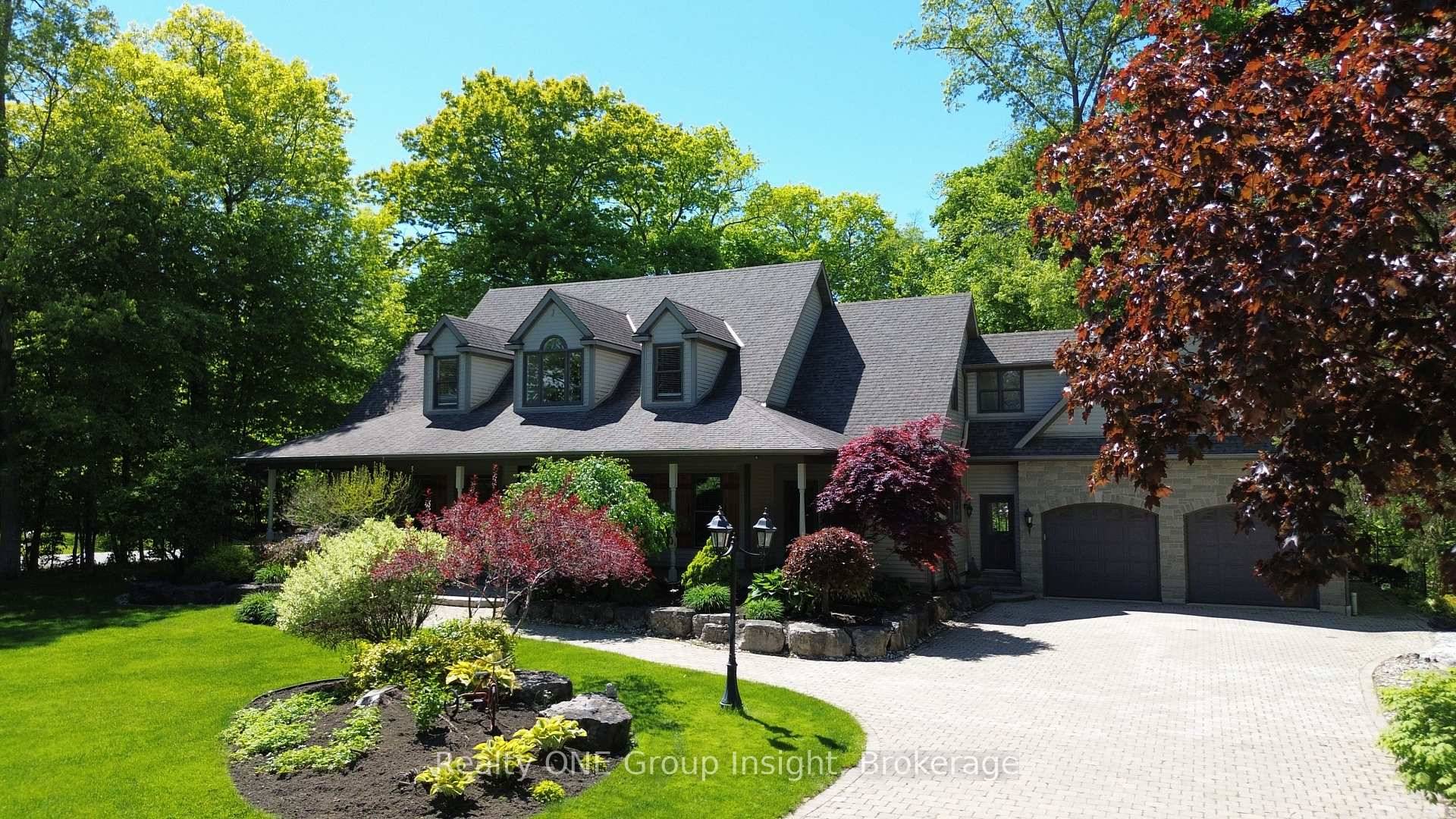 Take a look at this stunning home, nestled on just under an acre of lush, mature trees and beautifully enhanced with professional landscaping.