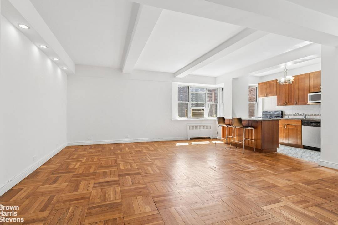 Enter via an inviting foyer opening to an expansive living dining with 5 windows 4 east facing and 1 south facing serving up excellent morning and midday light !