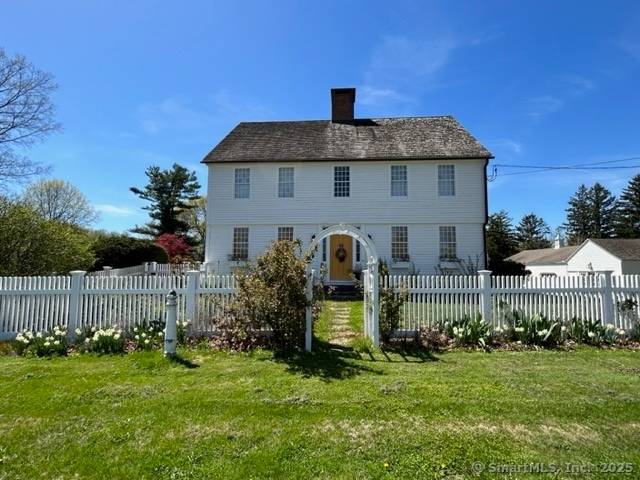 This extraordinary center chimney colonial blends rich history with modern elegance.
