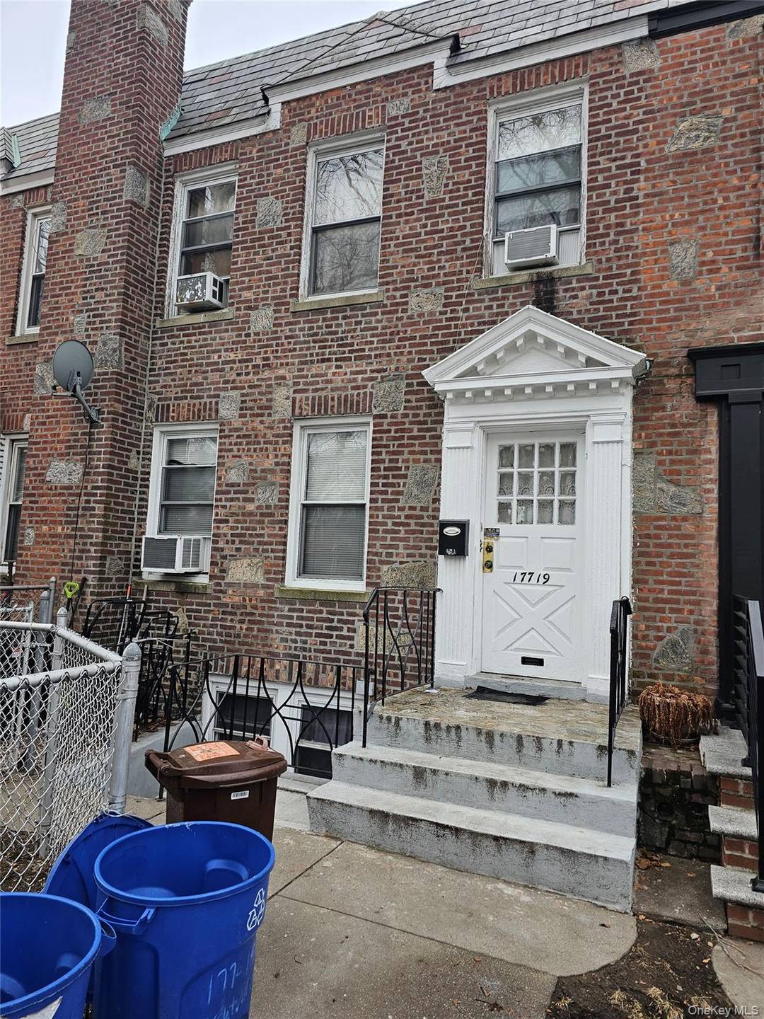 Welcome to this well maintained, attached brick two family home, now available for showings.