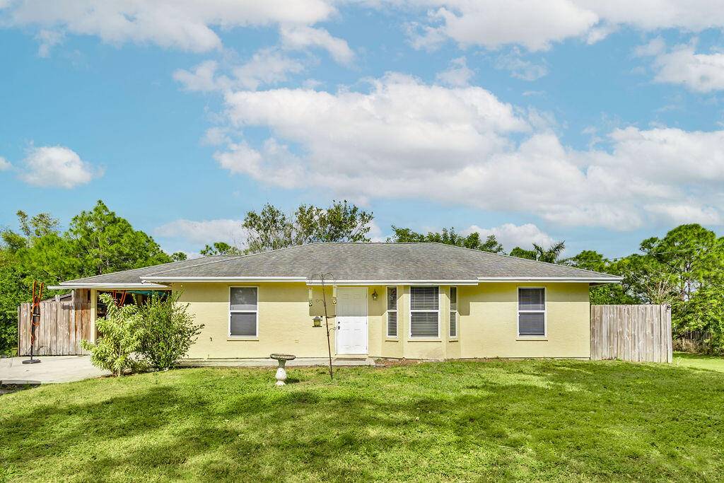 Charming 3 bedroom, 2 bath home with a split floor plan and carport, nestled on a fully fenced 1.