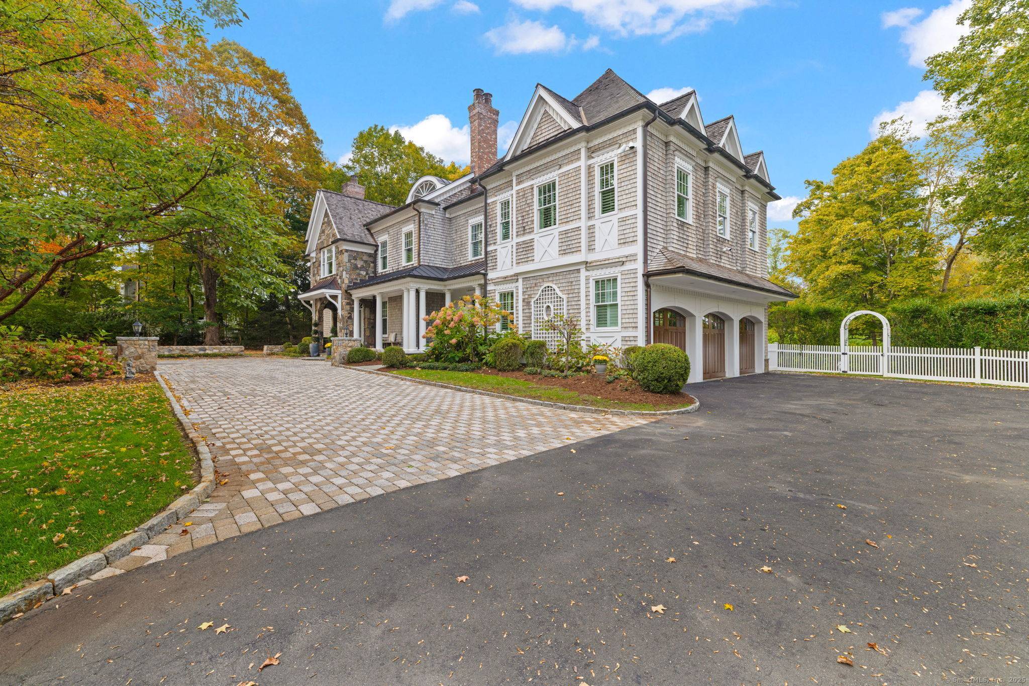 Built by renowned master builder John Heggland, this exceptional 7, 811 sq ft Georgian Colonial estate is gracefully sited on 2.