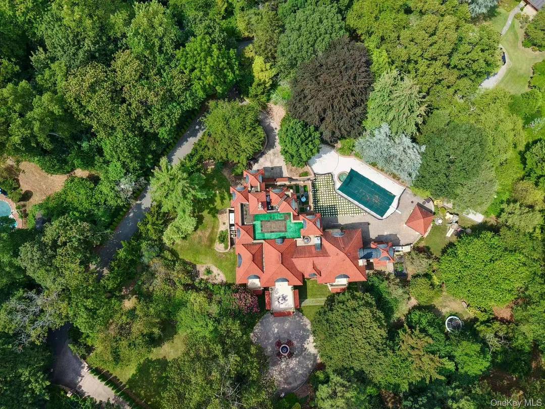 This exceptional Mediterranean inspired estate is nestled within the exclusive Village of Sands Point.