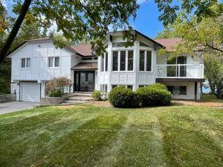 Motivated Seller in Prestigious Bayshore Village Rare Waterfront Opportunity.