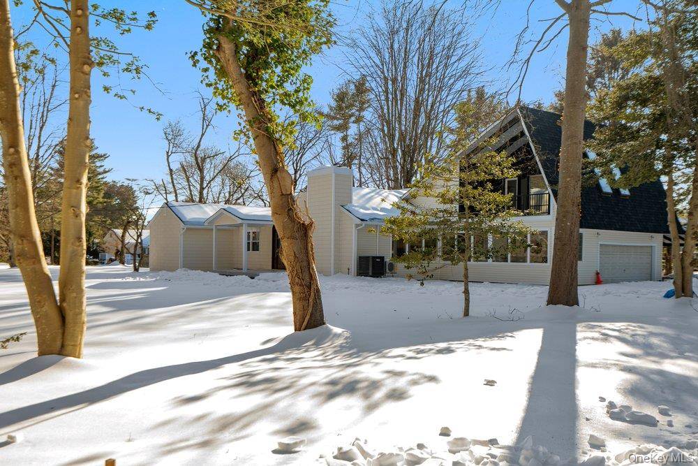 A Grand and Timeless High Ranch in the Heart of Cold Spring Harbor ; Cold Spring Harbor School District.