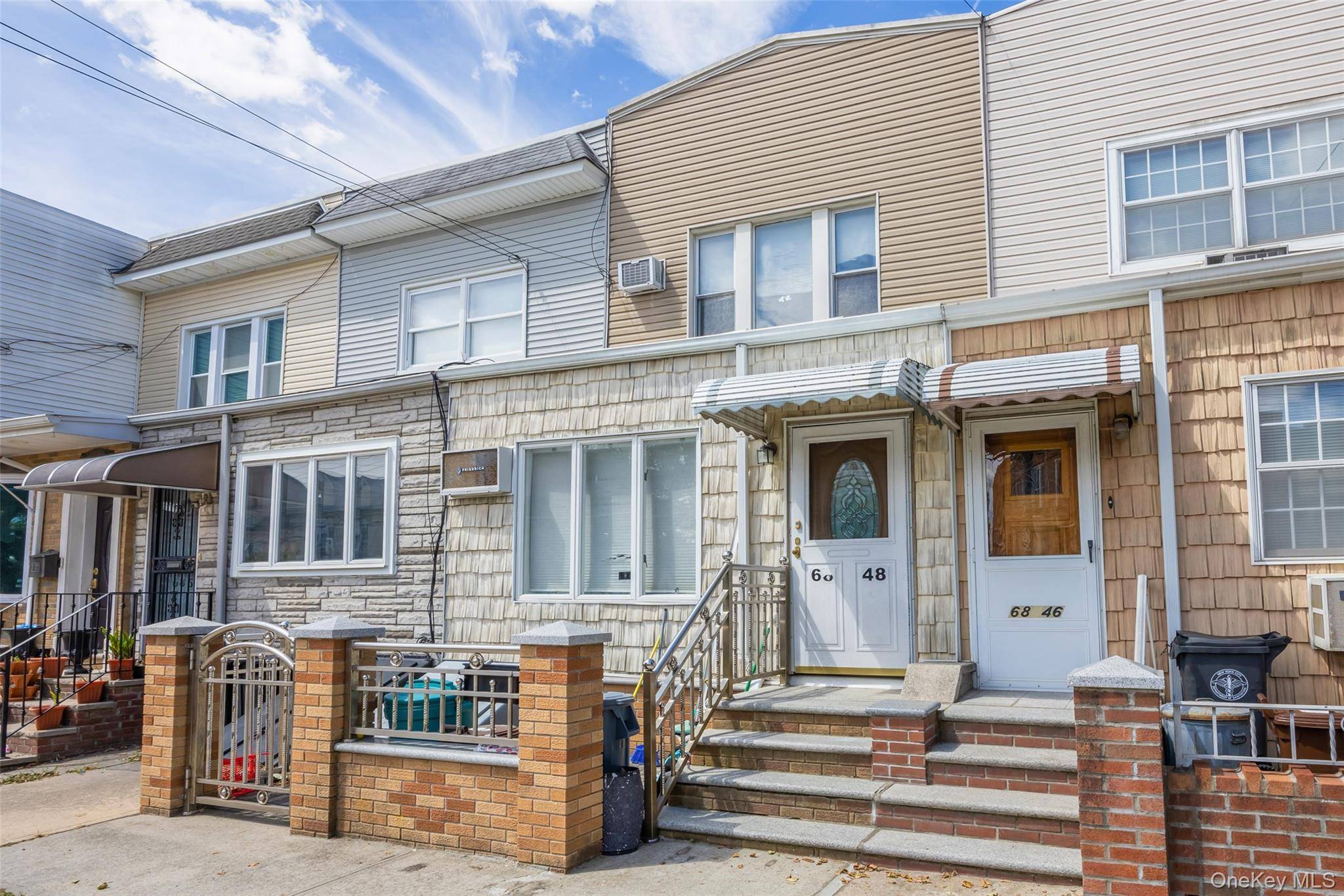 Welcome to this surprisingly spacious townhouse in Middle Village !