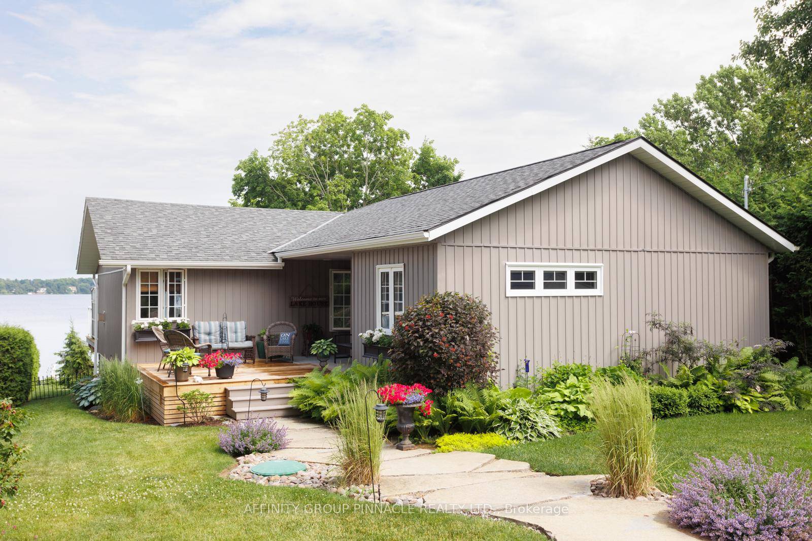 Experience the charm of lakeside living in this stunning year round, two plus one bedroom home on Sturgeon Lake.