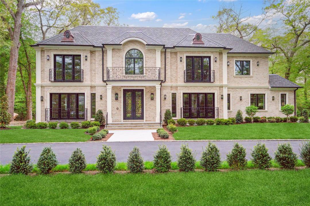 Muttontown Brand New Brick Center Hall Colonial Set on over two private acres on a quiet cul de sac, 20 Knollwood Road is an exceptional new construction estate that blends ...