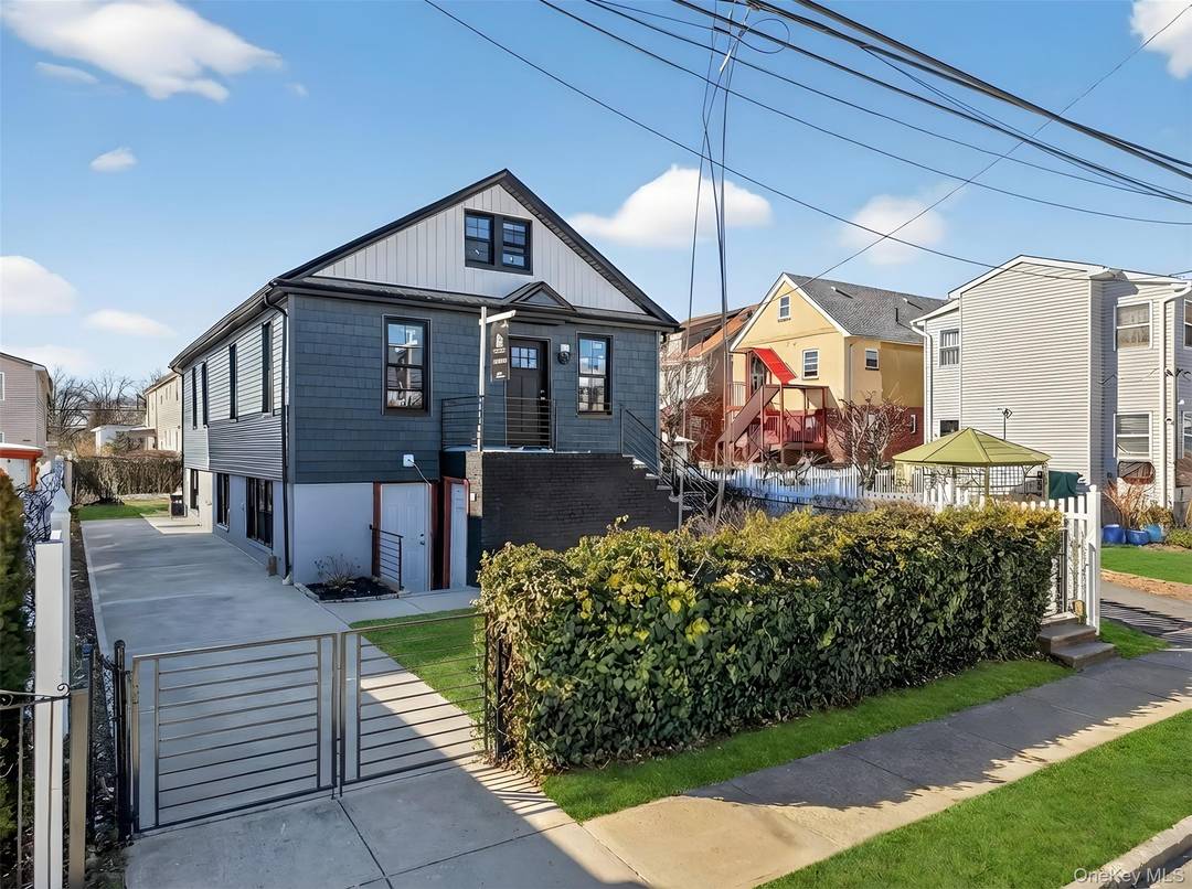 Welcome to 120 14 165th Street, a fully renovated two family home set on a 40 x 100 lot with a private driveway.