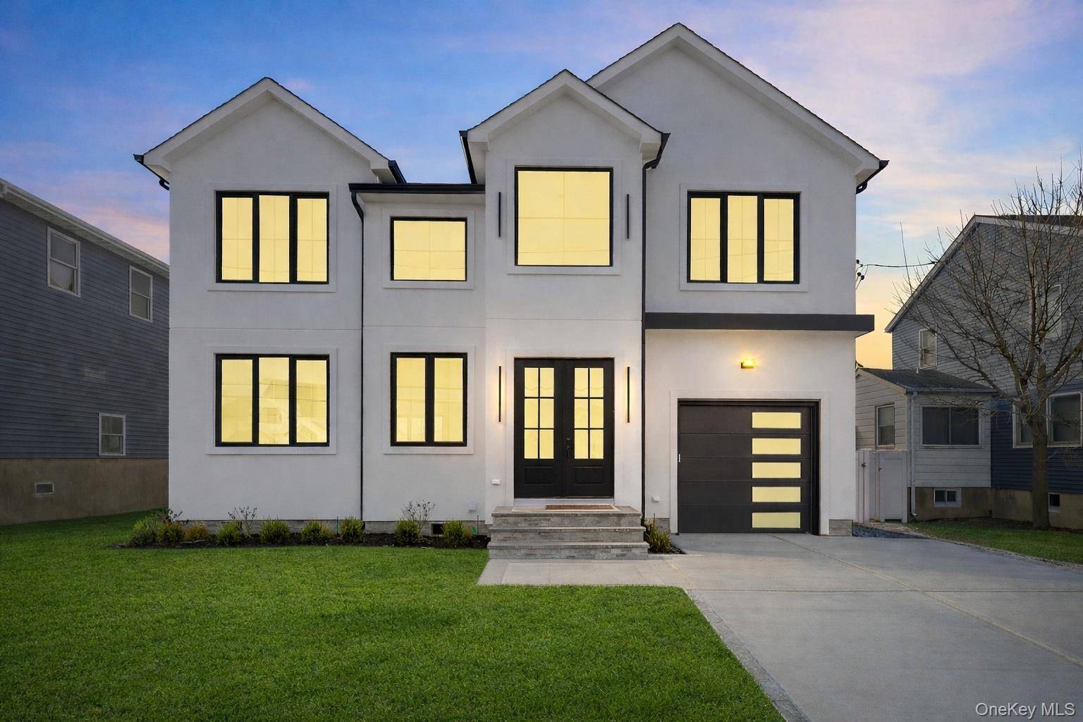 Exceptional brand new waterfront contemporary offering modern coastal living in the heart of Babylon Village.