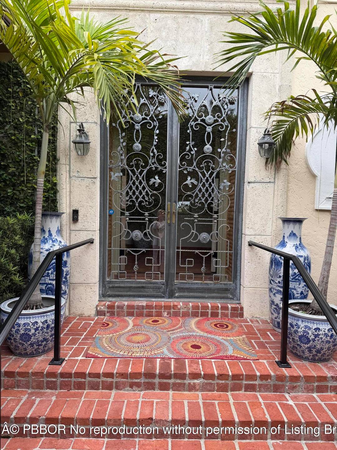 Quintessential Palm Beach Living tucked behind the hedges in a coveted island setting.