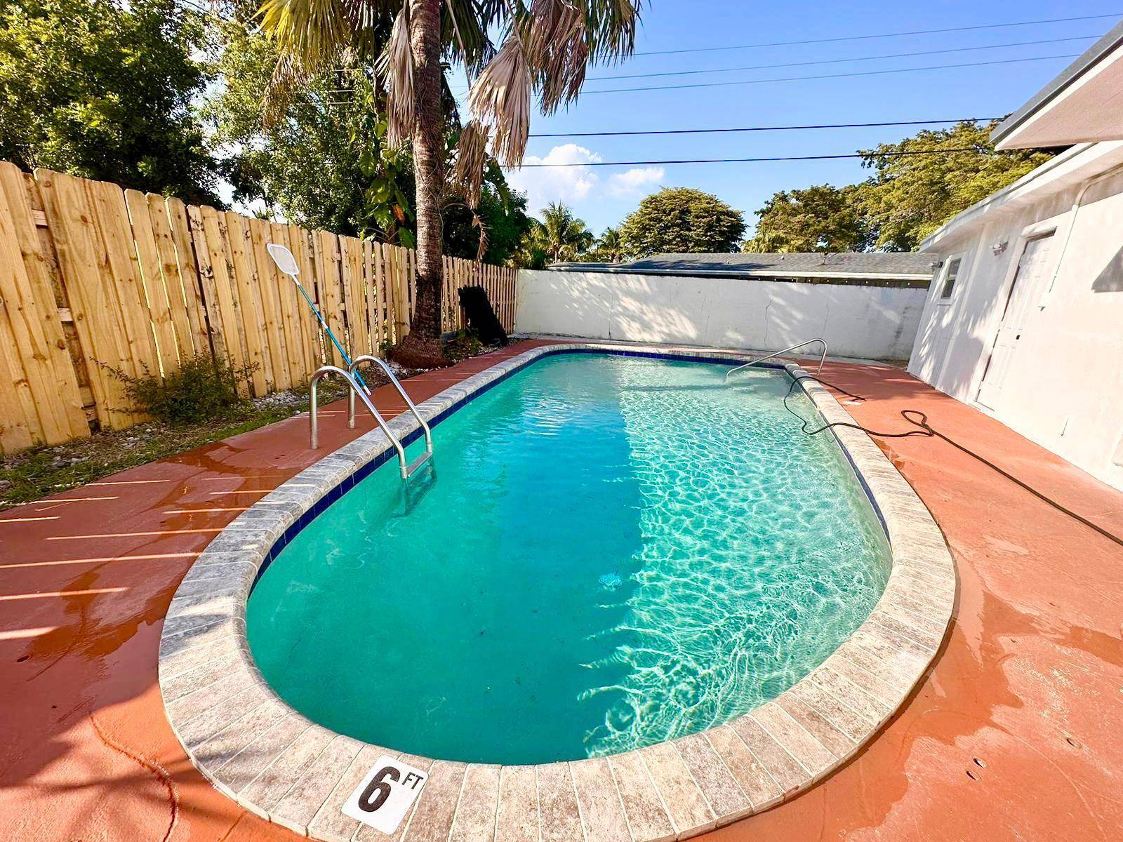 Spacious and fully equipped 4 bedroom, 4 bathroom one story home with a new roof 2025 and remodeled kitchen sitting on a highly desirable corner lot !