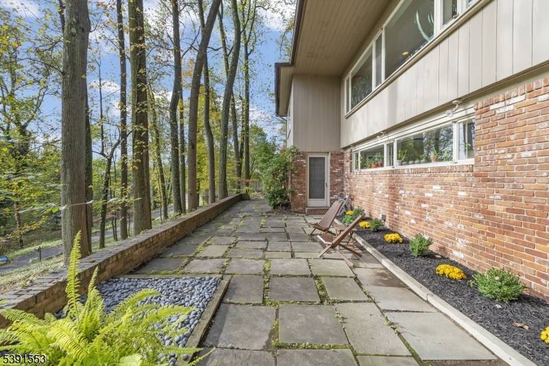 Set on a private one acre lot along a quiet road shared by only seven residences, this California style 4 BED 2.