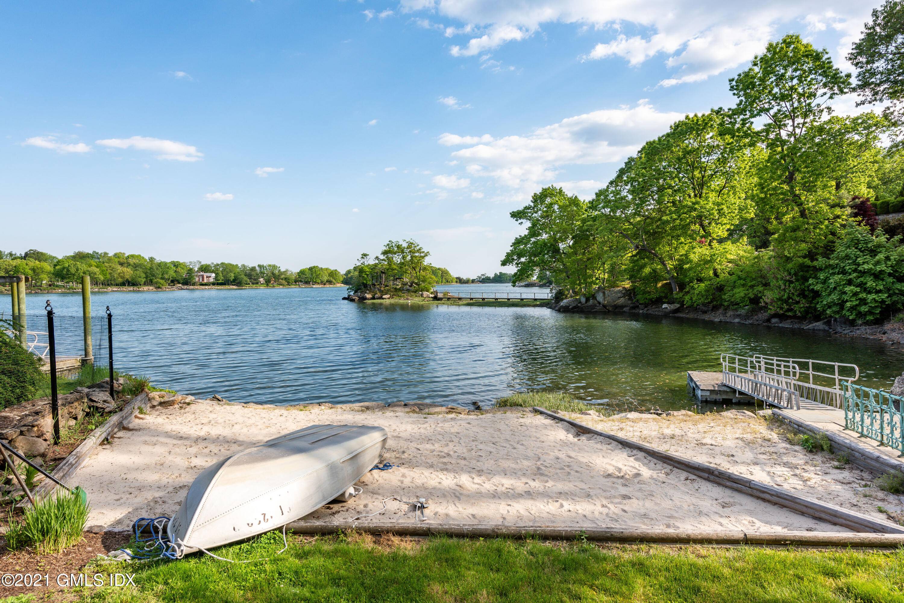 Waterfront with its own private sandy beach within the private gated Indian Harbor Association with 24 hour security.