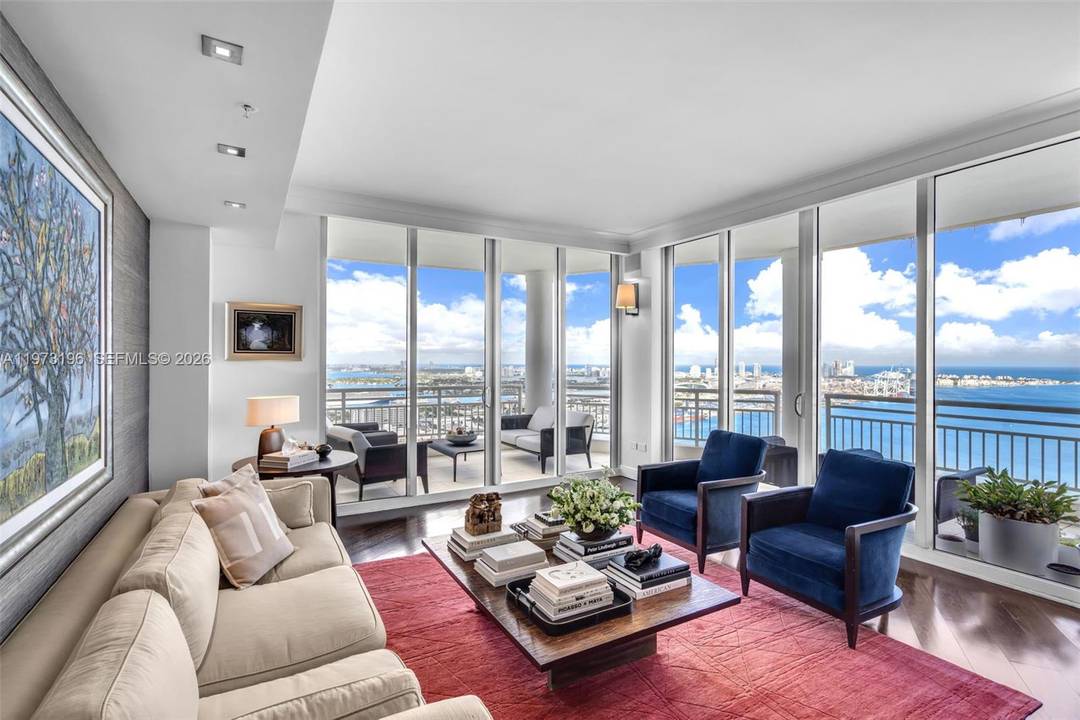 Gorgeous corner Lower Penthouse in the exclusive island community of Brickell Key, offering breathtaking Northeast water and skyline views.