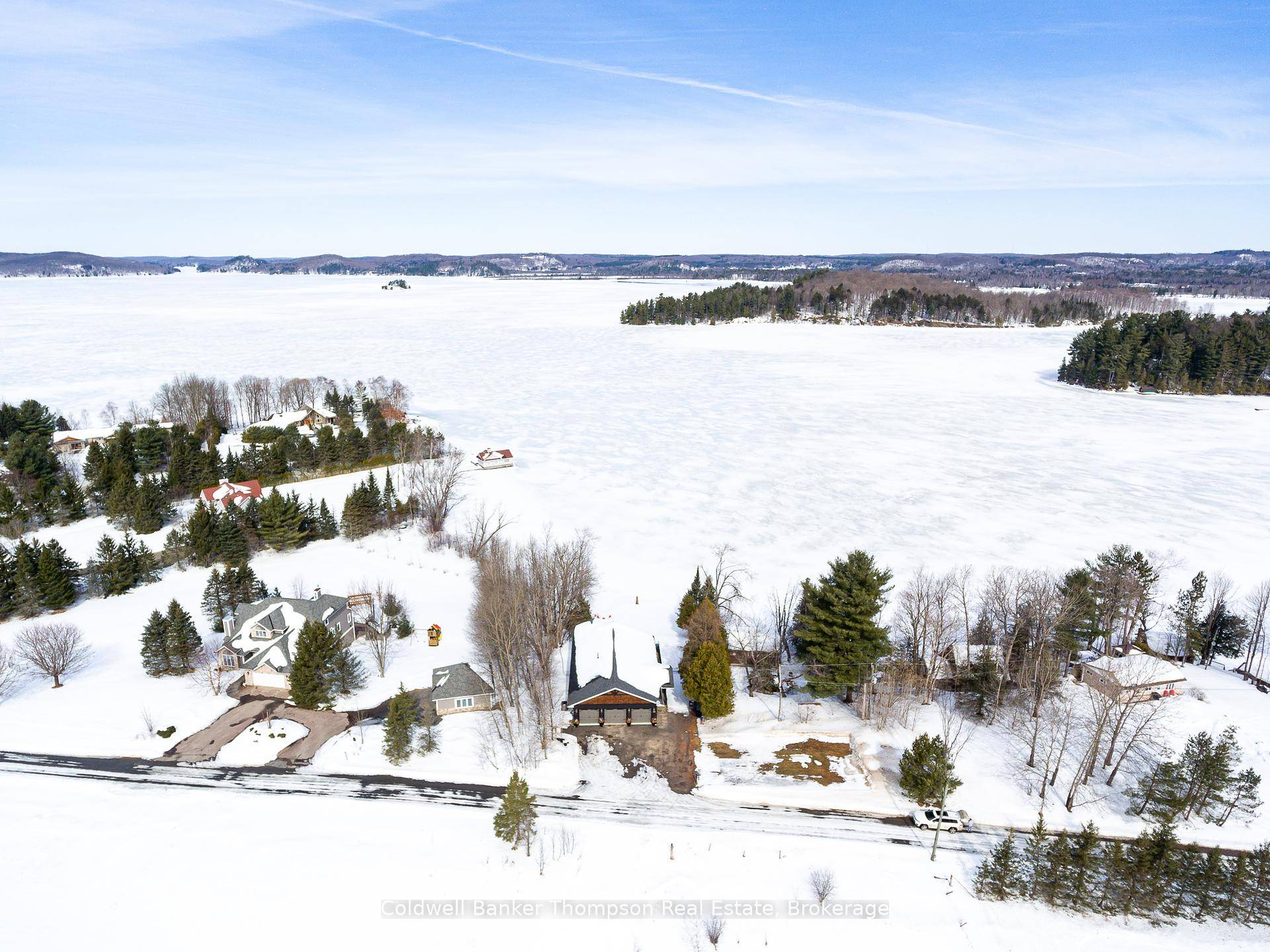 Fall in love with this exceptional executive home or cottage on the shores of Lake Vernon, where sophisticated design meets effortless lakeside living.