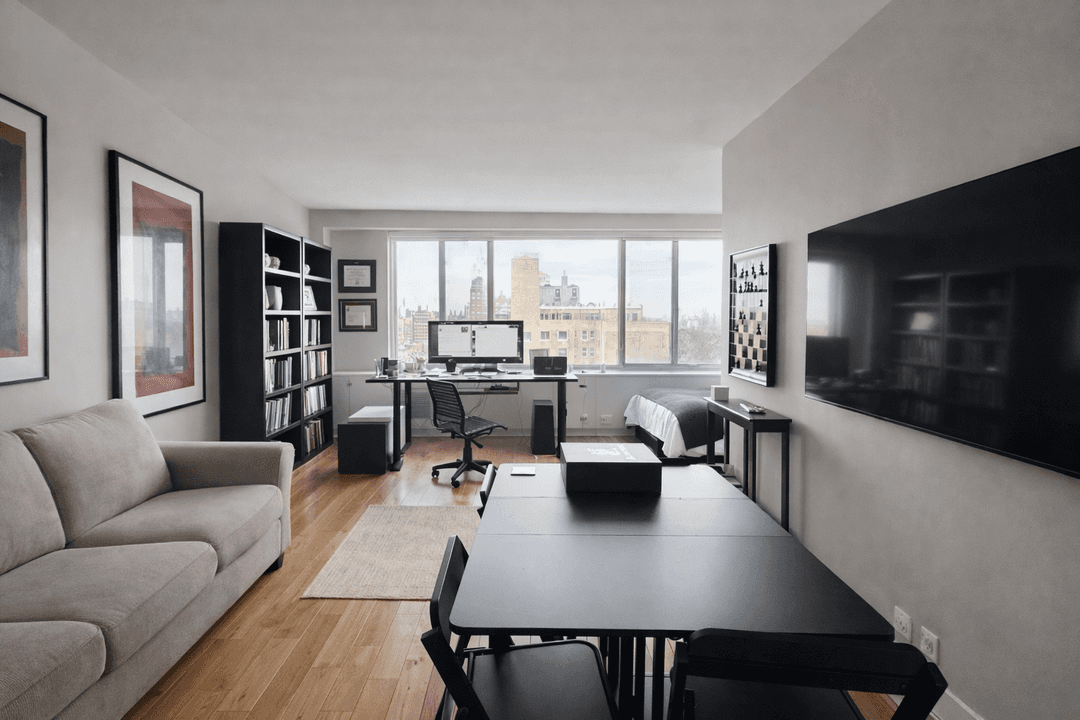 Enjoy open Central Park views from this spacious, light filled alcove studio residence on Central Park West Condominium.