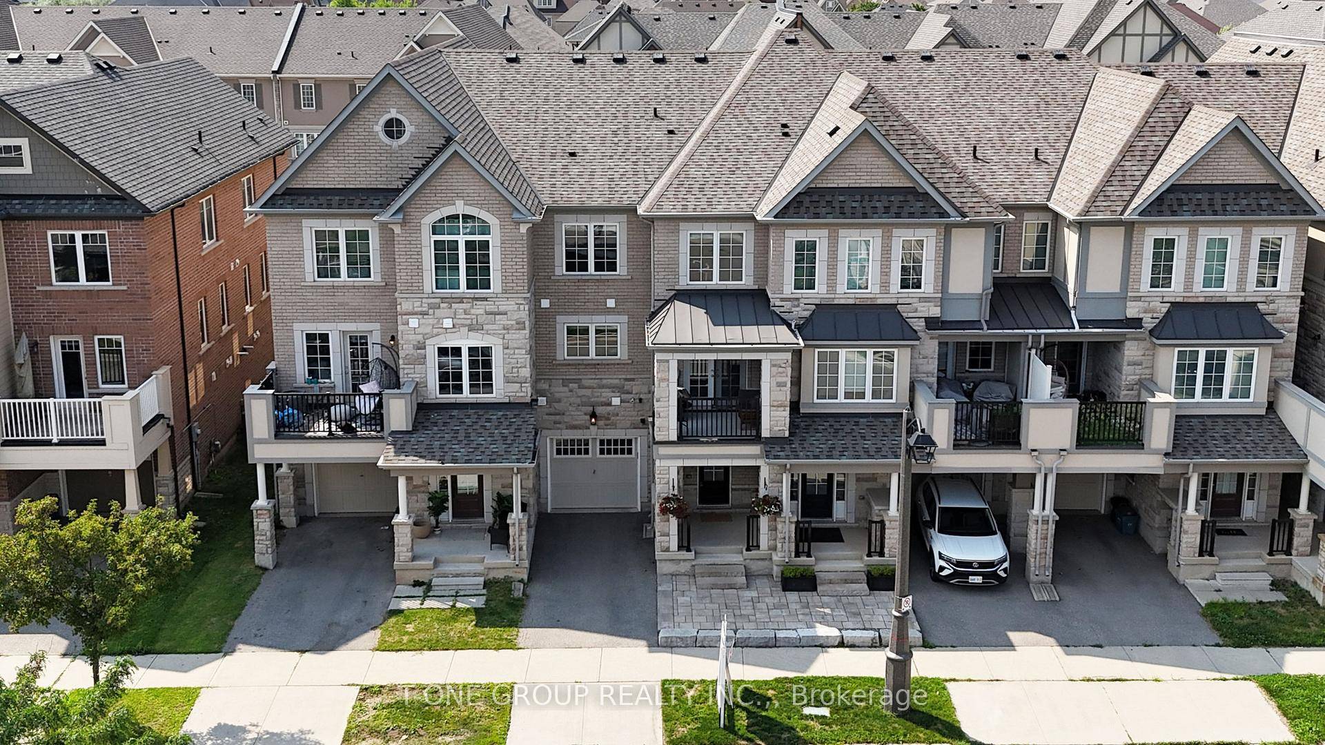 Welcome To 301 Ellen Davidson Drive, A Bright And Beautiful South Facing Freehold Townhouse NO MAINTENANCE FEES Offering Stunning Views And Natural Light All Day Long.