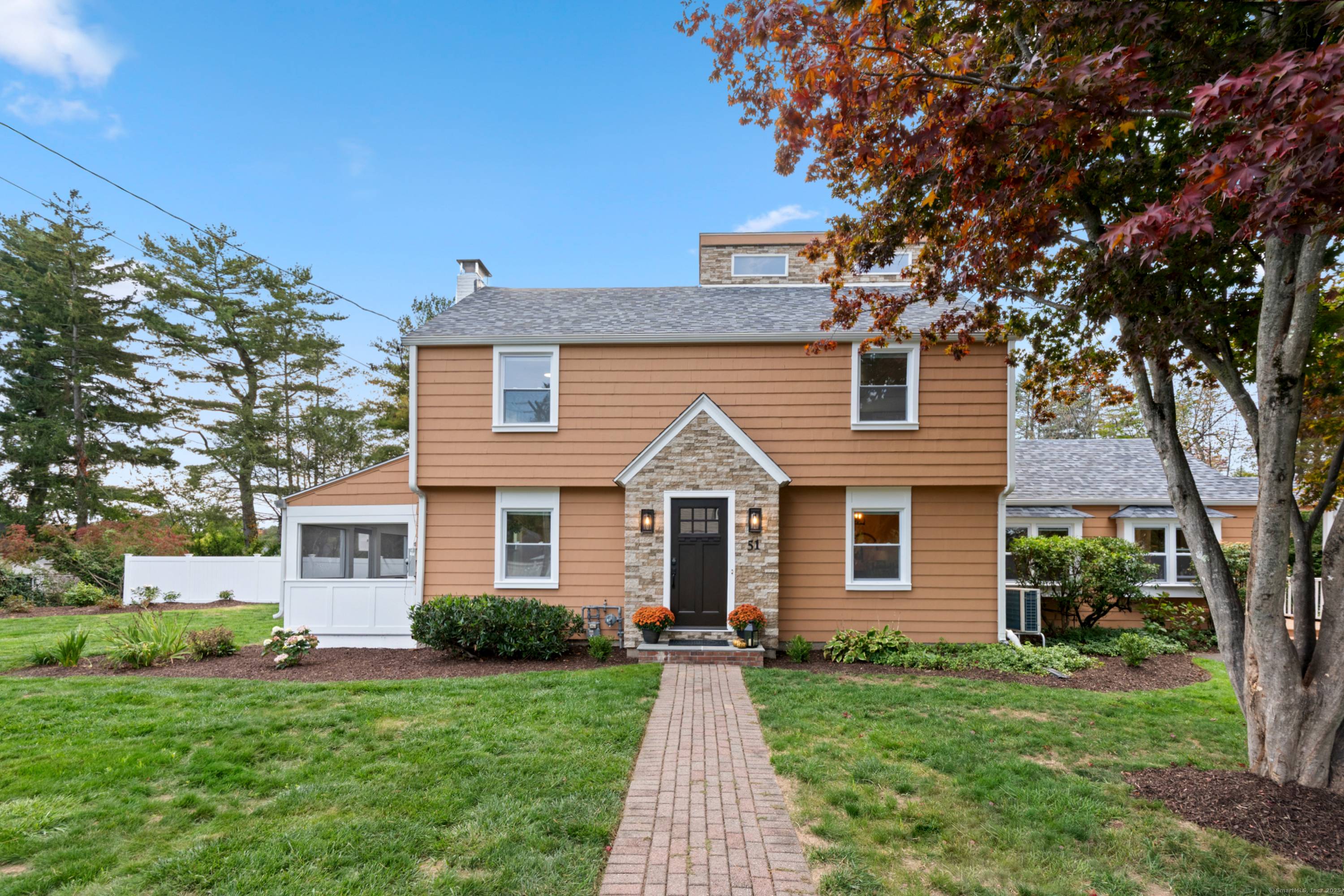 Perfectly located on a beautiful corner lot within walking distance to West Hartford Center, this stunning 4 bedroom, 2.