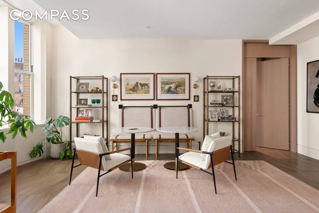 Welcome to 49 Chambers Street, Residence 8E an extraordinary corner home offering three spacious bedrooms plus a study, three en suite baths, and a refined powder room.