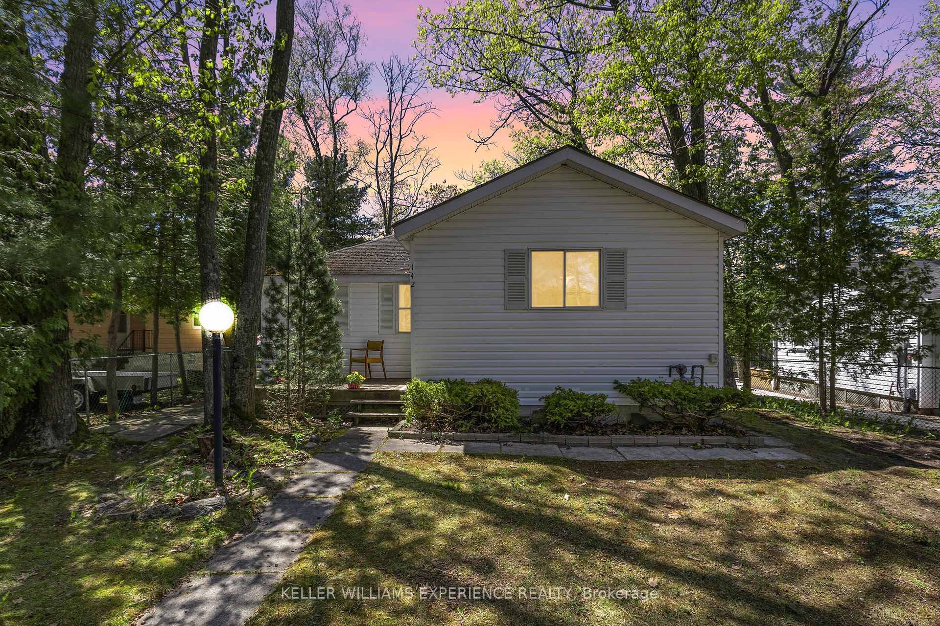 A warm welcome beckons you to 142 32nd St South, a detached bungalow with nearly 900 sq ft, awaiting your personal touch !