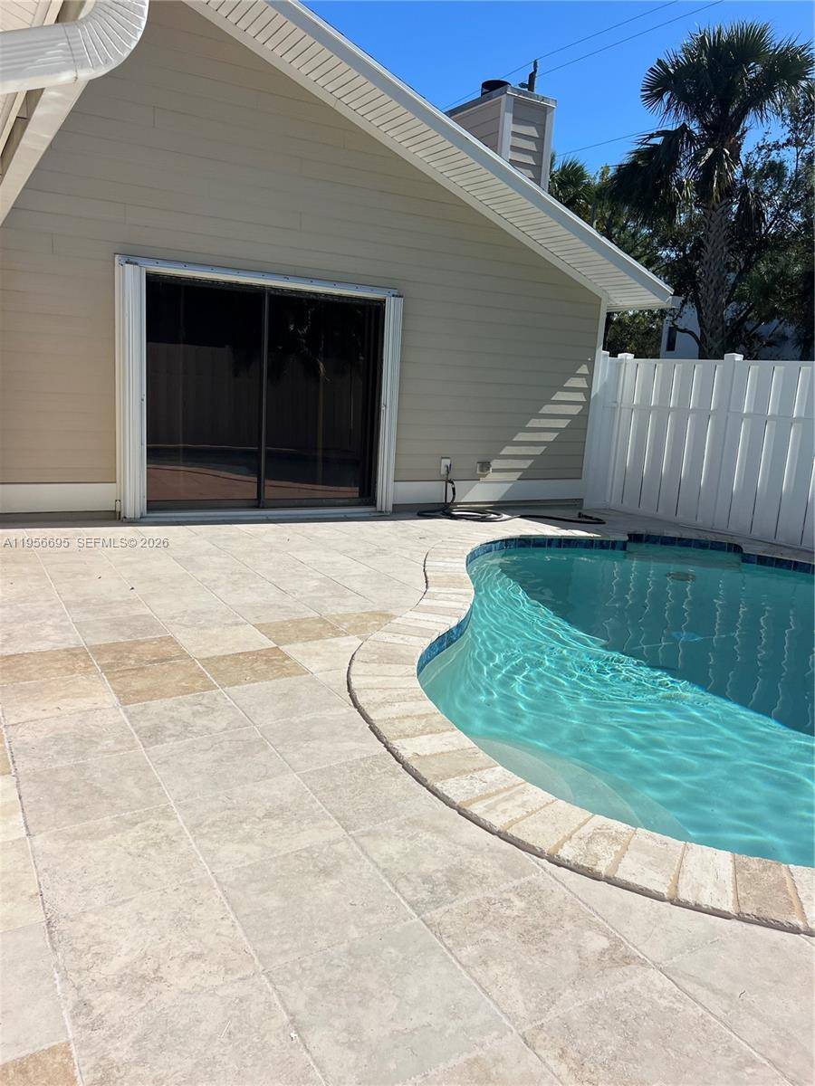 Updated 3 3 TH with 2 car coverd parking and private pool in the heart of Jupiter.
