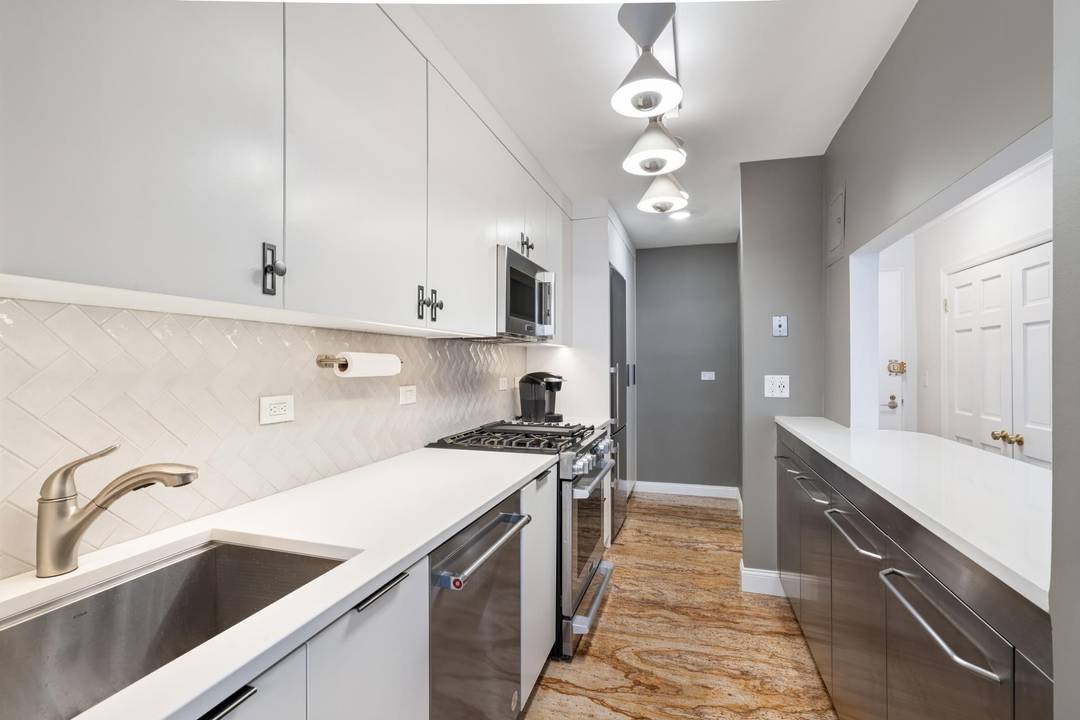 Rare opportunity to own a stunning, sunlit, COMPLETELY RENOVATED oversized 1 bedroom plus custom home office with a Miele WASHER DRYER, and easily convertible to a 2 bedroom.