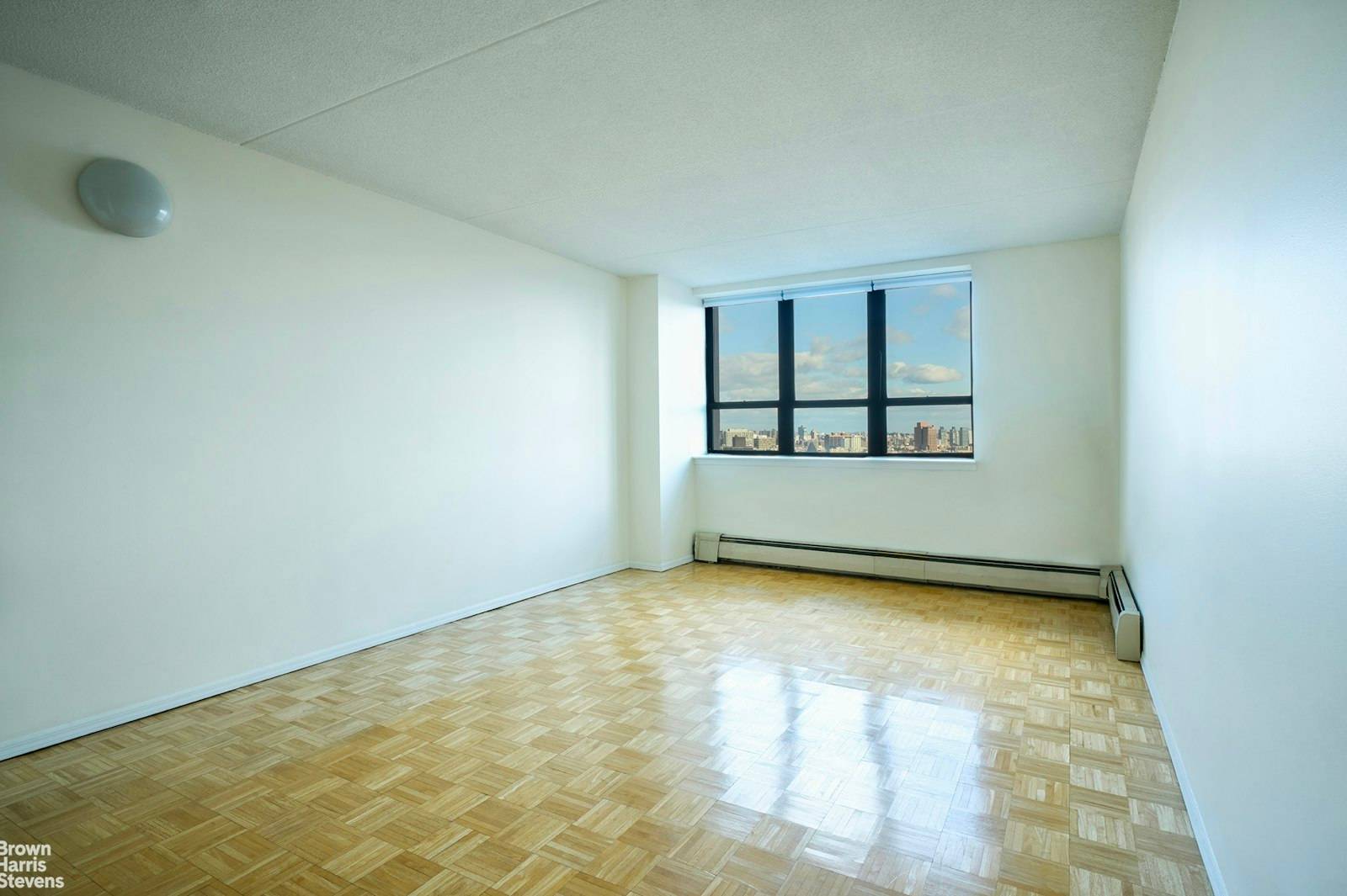 Apartment 20D, located on the top floor, features an inviting entry foyer, generous closet space, a spacious kitchen with a dishwasher, and stunning views of Central Park.