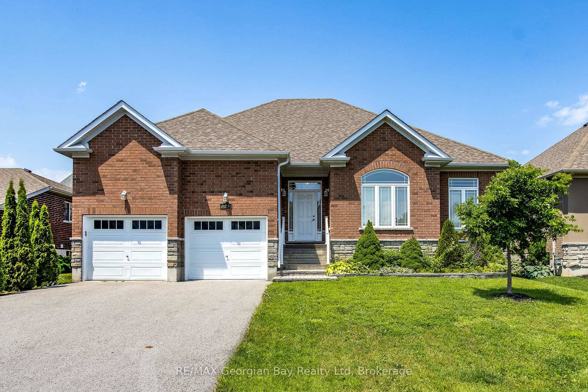Welcome to this stunning open concept all brick bungalow nestled in one of the area's most sought after neighborhoods just a short stroll to Little Lake Park.