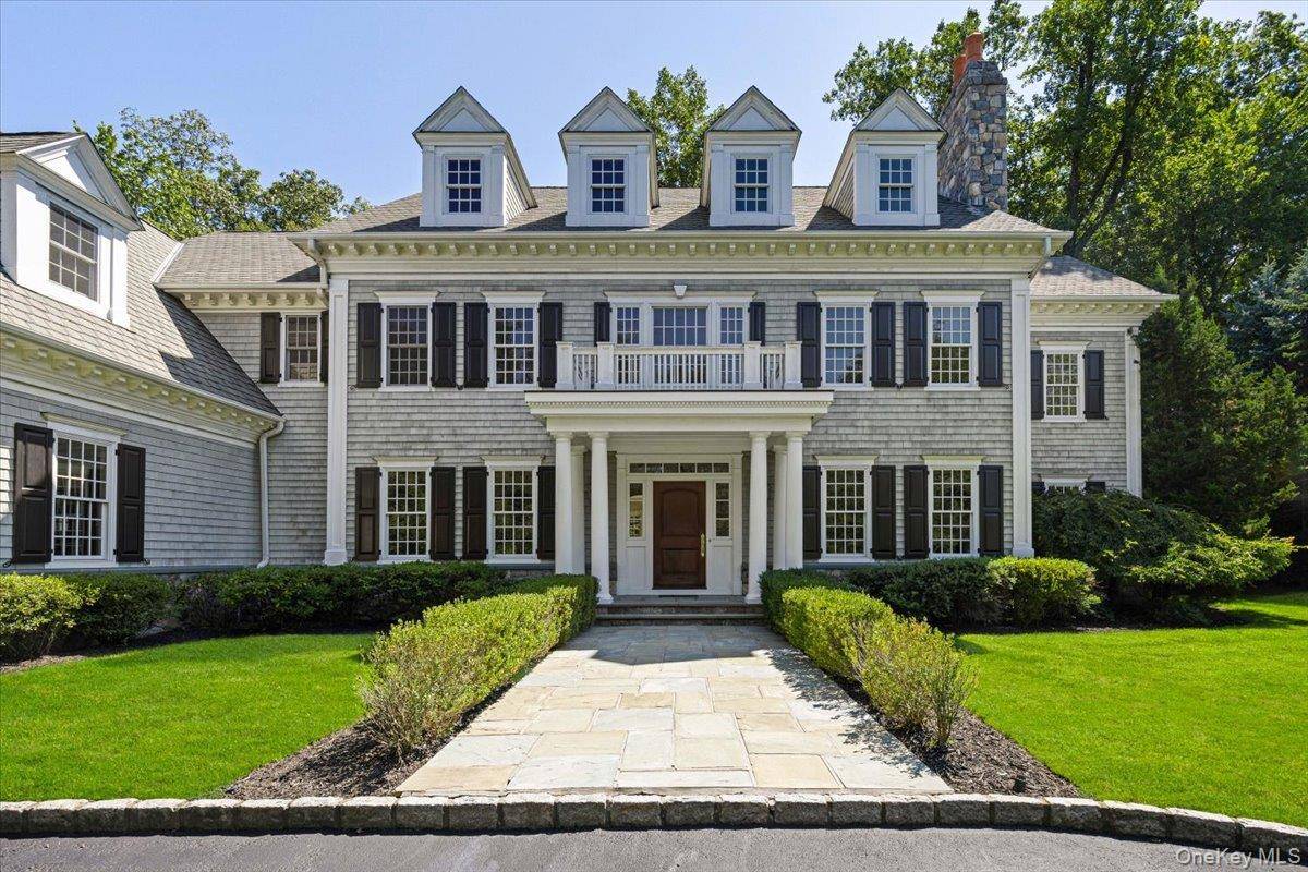Welcome to 1 Cedar Lane, an elegant shingle style Colonial nestled in the prestigious Purchase Estates.