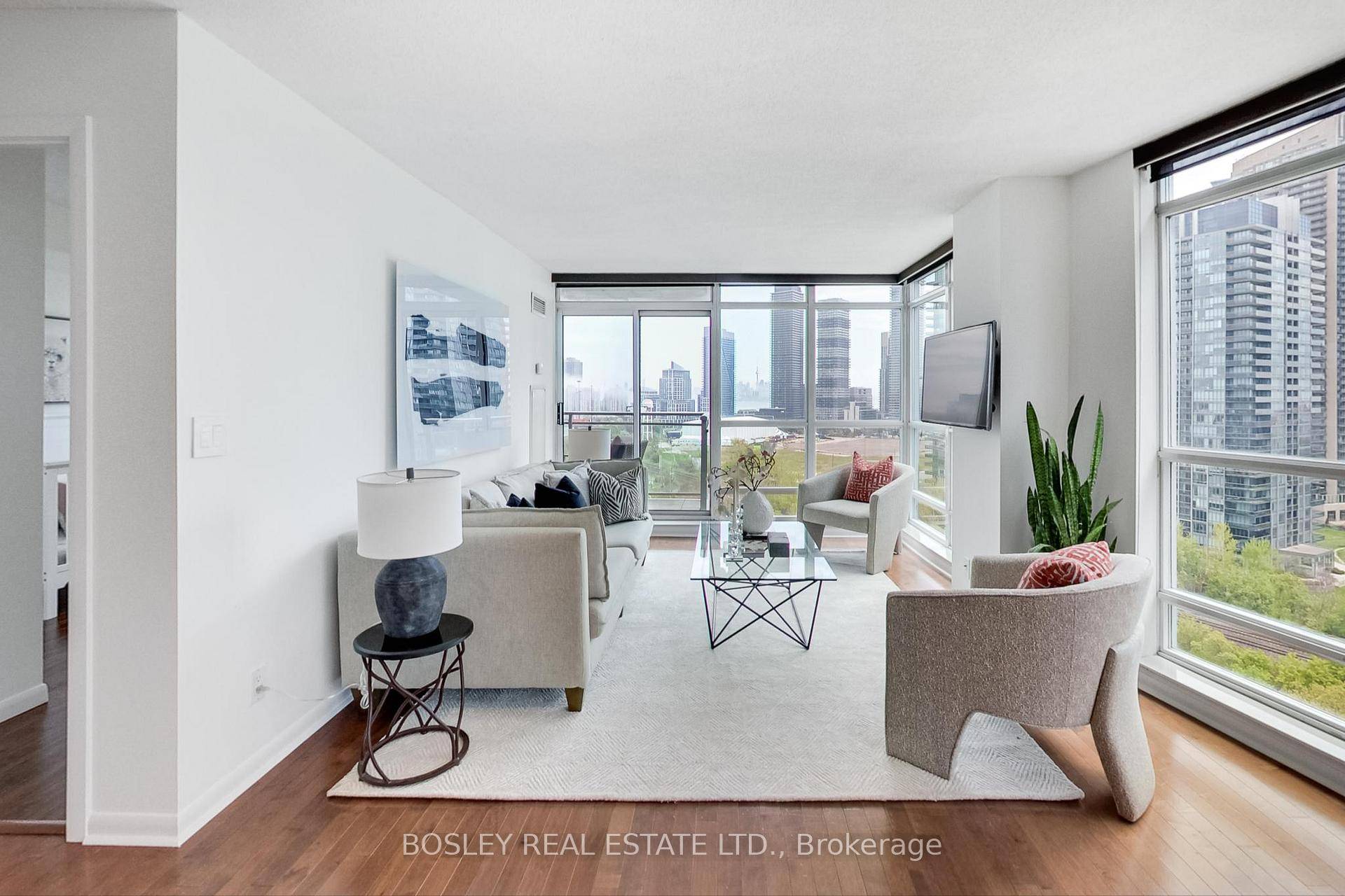 Welcome to Suite 1607 at 185 Legion Rd N, offering stunning southeast views of the lake, city skyline, Mimico Creek, lush greenery, and even the CN Tower in the distance.