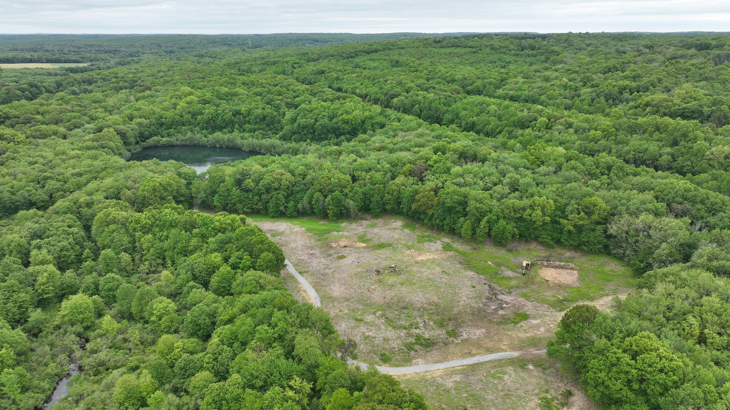 Welcome to 40 Caverly Mill Road, where nearly 86 acres of unspoiled natural beauty await.