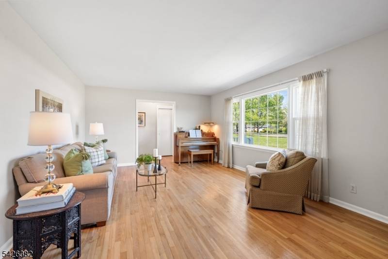 Original owner and cute as a button, this freshly painted ranch offers easy one floor living on a beautiful 1 acre lot.