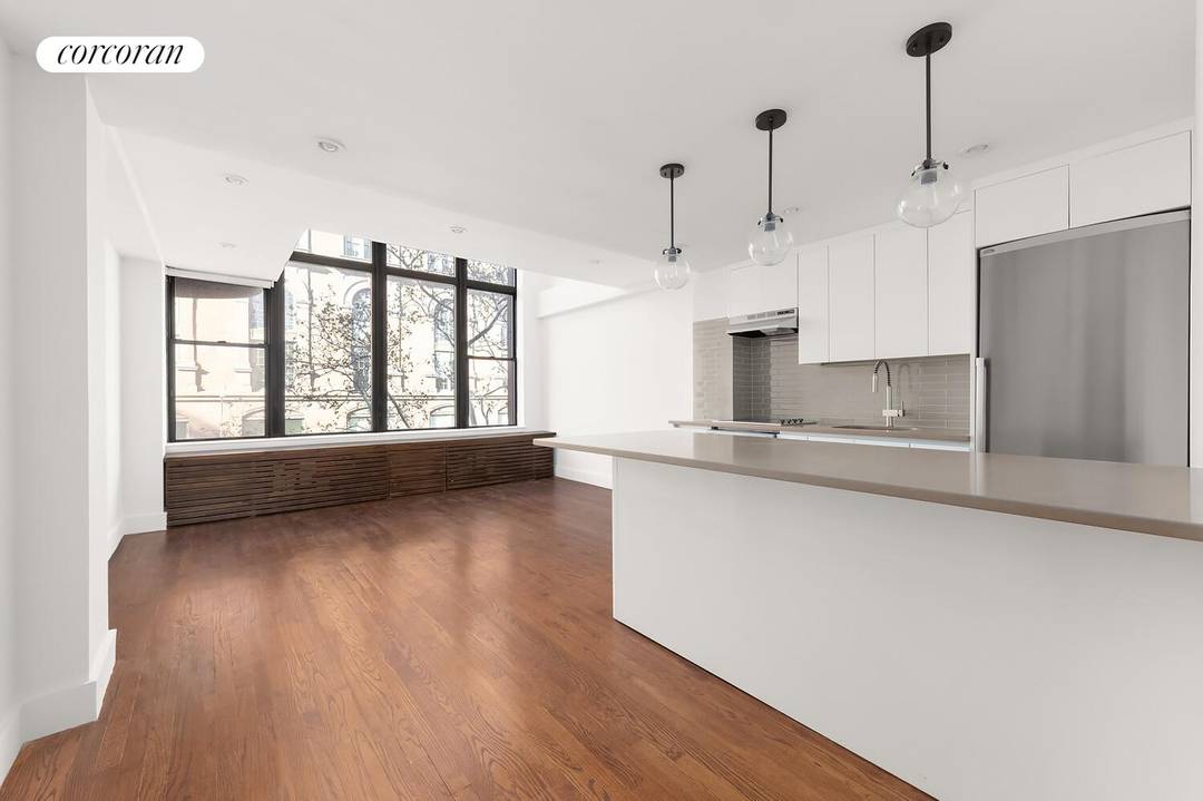 Welcome to Residence 3C at 65 Cooper Square a rare duplex one bedroom offering 17 foot ceilings, soaring windows, contemporary finishes, and a uniquely spacious layout in one of downtown's ...