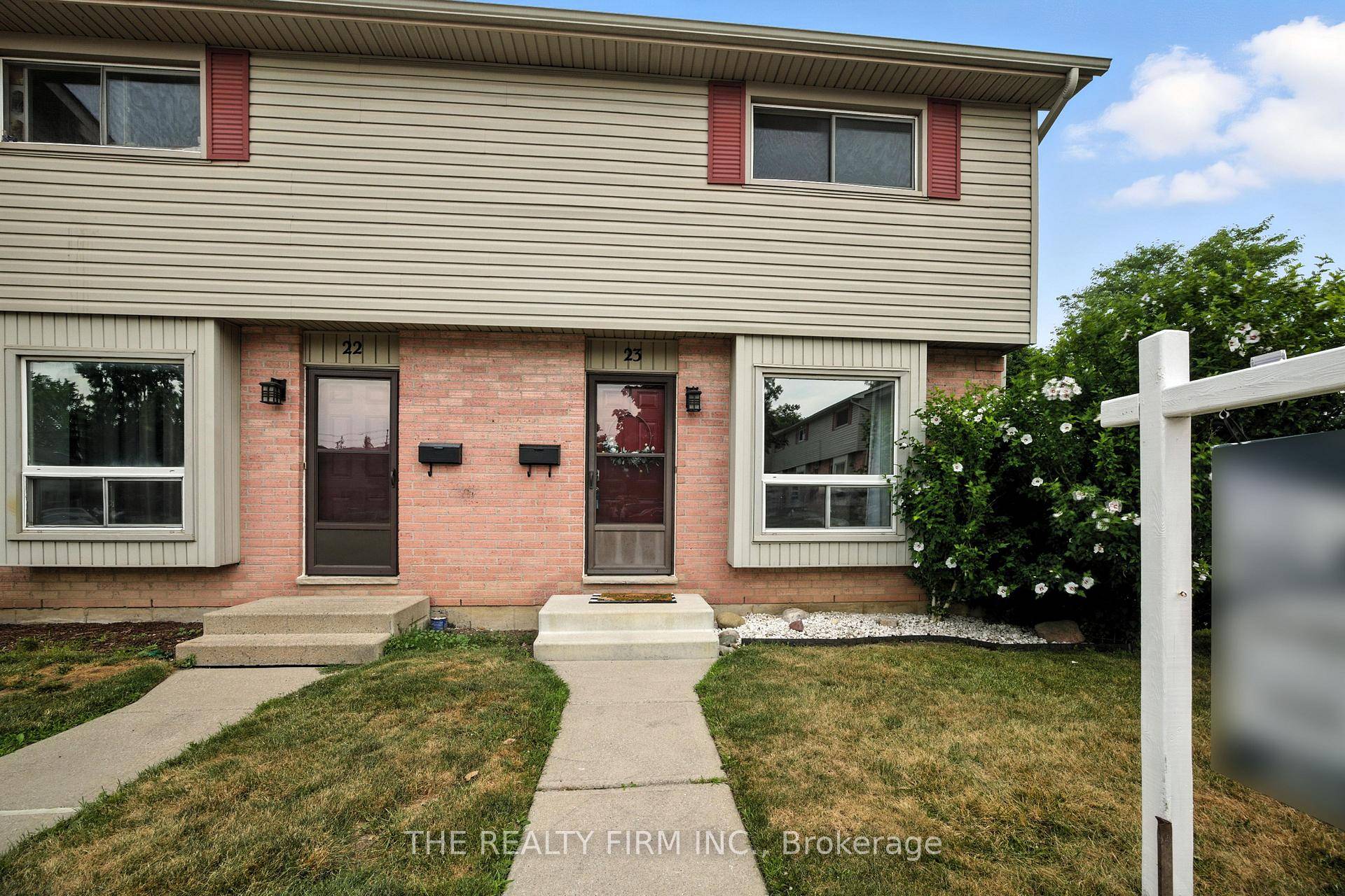 Welcome to 23 1200 Cheapside Street, a bright end unit townhome in a quiet complex in East London, backing onto Genevieve Park.