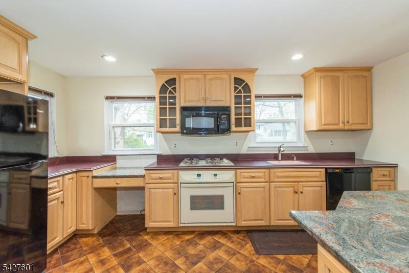 Terrific expanded ranch with remodeled kitchen and bathrooms.