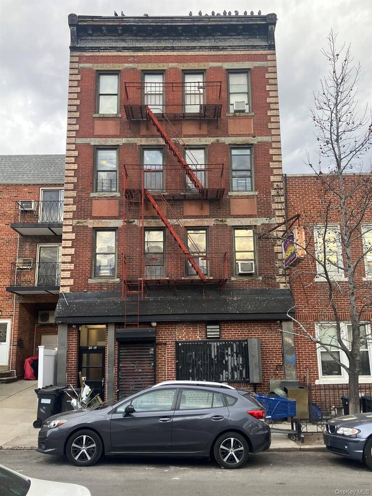 6 family building with vacant 1200 sq ft store front on ground floor formerly a bar.