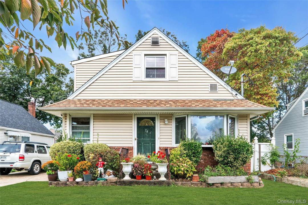 Welcome to 54 E 15th Street, a charming residence nestled in the heart of Huntington Station, NY.